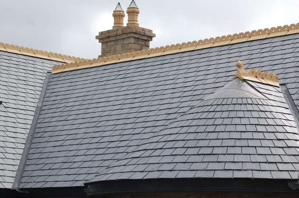Slate roof featuring SSQ Del Carmen Slate, showcasing its elegant texture and color in a classic architectural design.