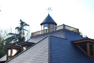 A beautifully crafted slate roof, emphasizing traditional design elements and quality construction.