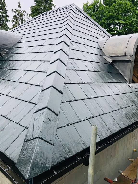 Corner of a slate roof with slate ridges using Riverstone phyllite
