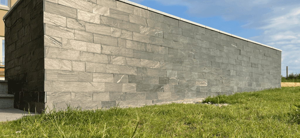 Riverstone cladding low wall