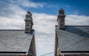 View of two cottage gables against a blue sky, demonstrating the uniform and premium appearance of Riverstone slate.
