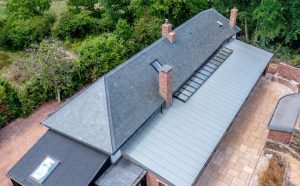 Aerial view of the complex Bakers Cottage roofline, featuring Riverstone Ultra Natural Slate blending perfectly with the surrounding architecture.