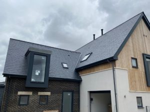 SSQ Del Prado natural slate roof on contemporary lakeside homes at Lakeview Crescent, Chelmsford