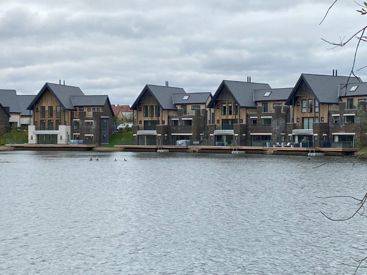 Modern residential scheme featuring SSQ Del Prado natural slate beside a private lake in Chelmsford