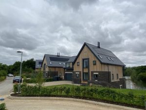 SSQ Del Prado slate blending seamlessly with the lakeside environment at Lakeview Crescent development.
