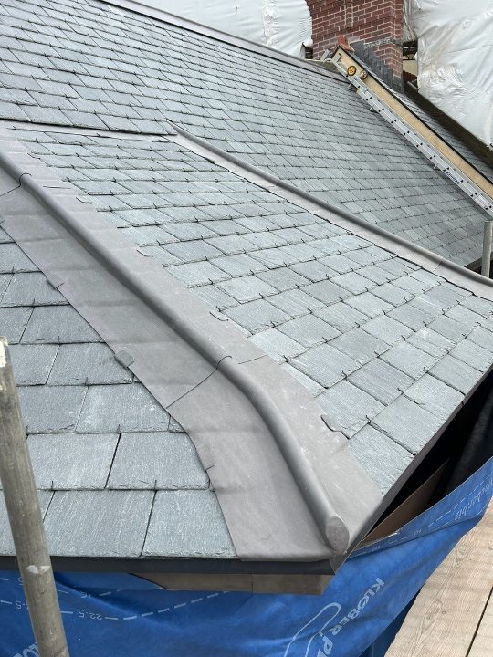 Close-up of SSQ Riverstone natural slate roof and valley detail at Baggy Cottage, North Devon,